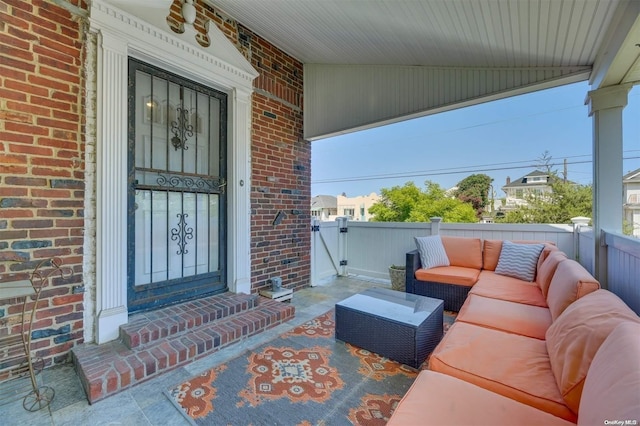 215 Roosevelt Blvd, Long Beach, NY 11561 - property entrance with an outdoor living space and brick siding