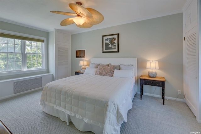 bedroom with ceiling fan, radiator heating unit, light colored carpet, and ornamental molding