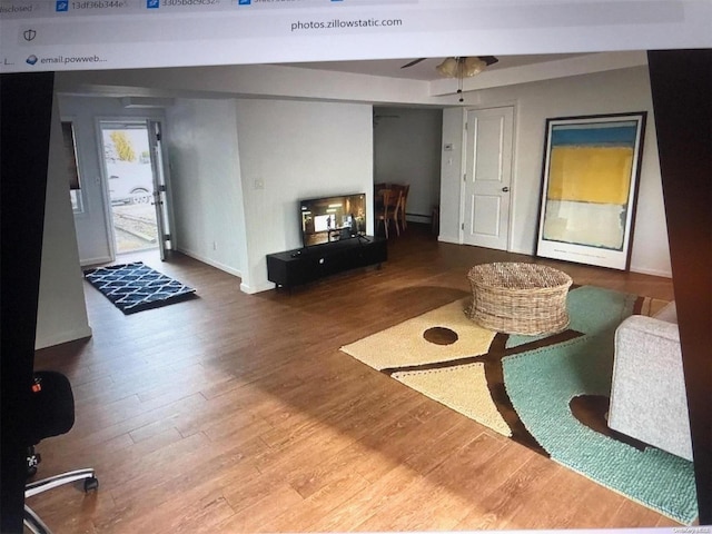 215 Roosevelt Blvd, Long Beach, NY 11561 - living room featuring wood finished floors, ceiling fan, and baseboards