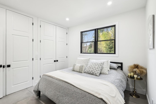 bedroom with recessed lighting and baseboards