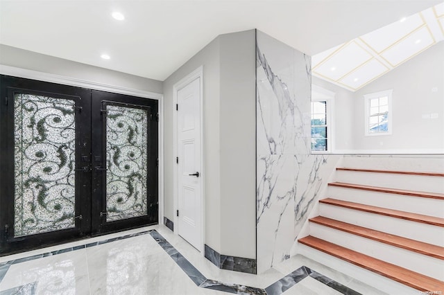 22 Solar Ln, Searingtown, NY 11507 - foyer entrance with french doors, recessed lighting, inlaid floor details, stairway, and vaulted ceiling