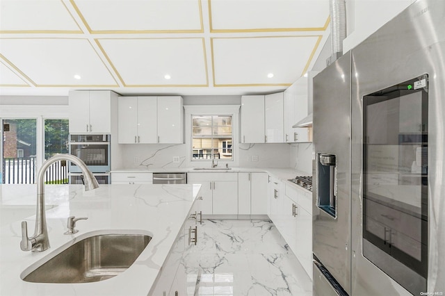 22 Solar Ln, Searingtown, NY 11507 - kitchen with a sink, stainless steel appliances, light stone counters, white cabinets, and recessed lighting