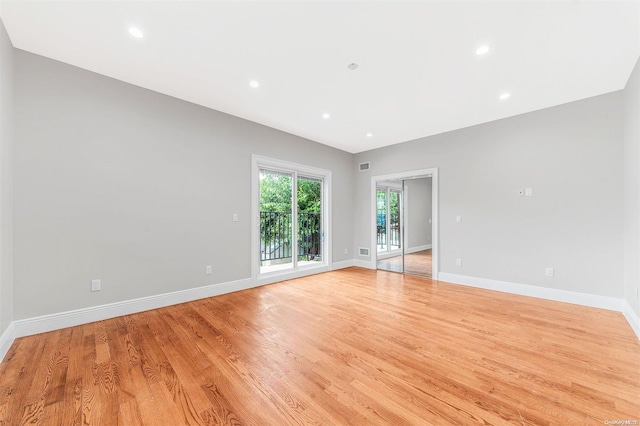 spare room with light hardwood / wood-style flooring