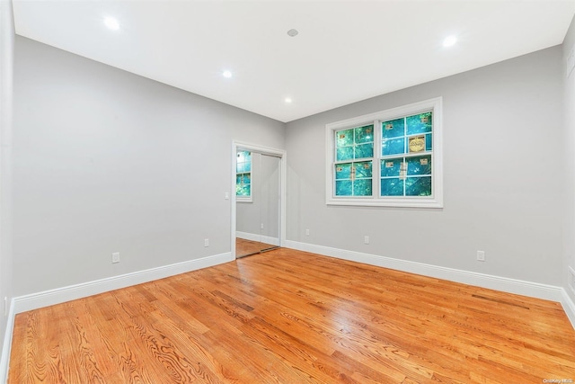 spare room featuring light hardwood / wood-style flooring