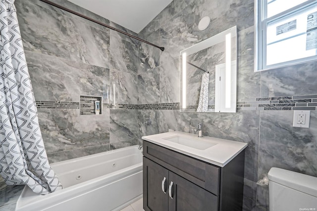 22 Solar Ln, Searingtown, NY 11507 - bathroom featuring tile walls, a combined bath / shower with jetted tub, vanity, and toilet