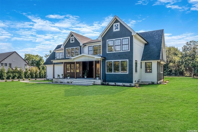 2060 Shipyard Ln, East Marion, NY 11939 - back of property featuring a lawn, covered porch, a shingled roof, and board and batten siding