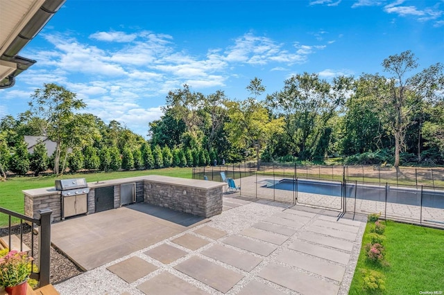 view of patio featuring an outdoor kitchen and area for grilling