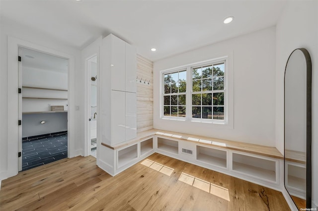 mudroom with light hardwood / wood-style flooring