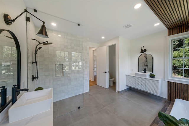 2060 Shipyard Ln, East Marion, NY 11939 - full bathroom with a walk in shower, toilet, vanity, recessed lighting, and concrete flooring