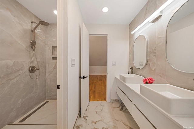 2060 Shipyard Ln, East Marion, NY 11939 - full bath featuring a marble finish shower, double vanity, marble look tiles, and recessed lighting