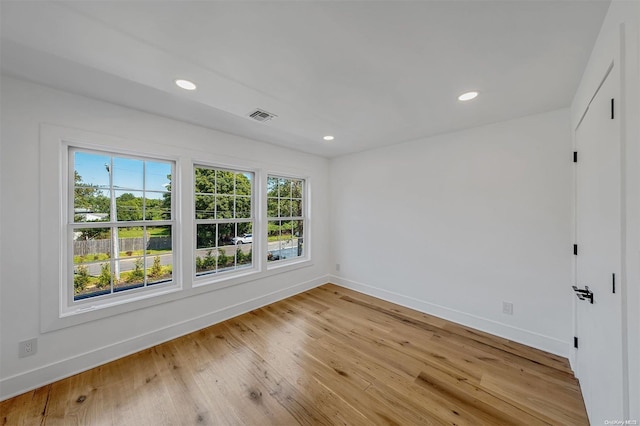 spare room with light wood-type flooring