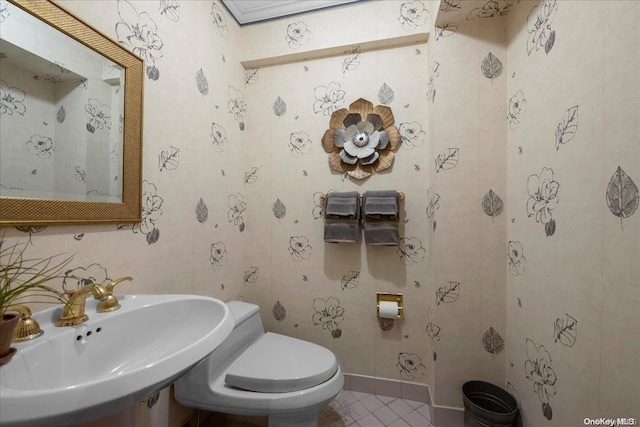 bathroom with sink, tile patterned flooring, and toilet