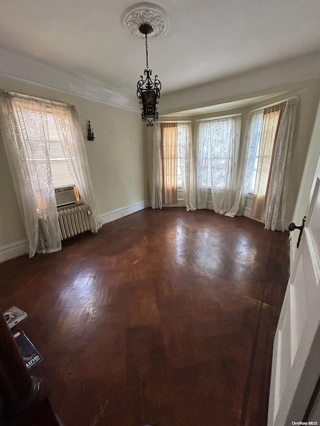 unfurnished room featuring radiator