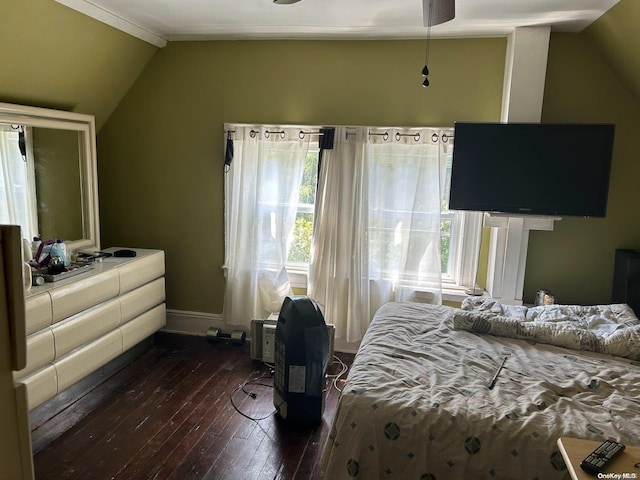 bedroom with vaulted ceiling, ceiling fan, and dark hardwood / wood-style floors