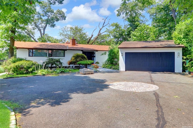 single story home featuring a garage