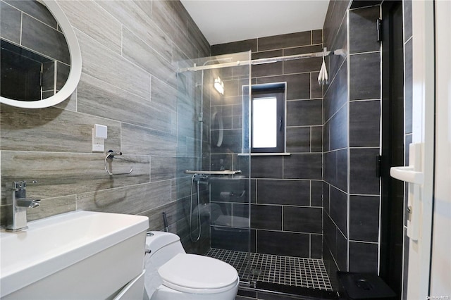 bathroom featuring walk in shower, vanity, tile walls, and toilet