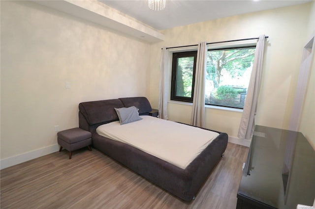 bedroom featuring wood-type flooring