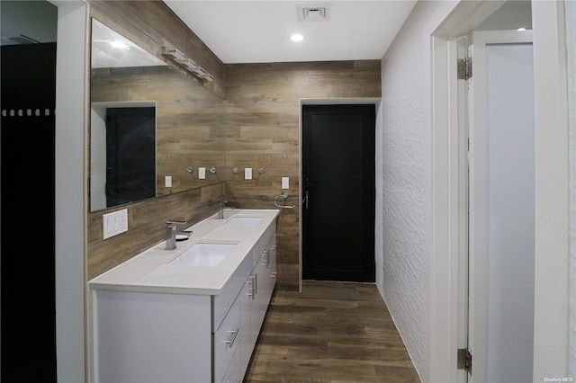 bathroom with vanity and wood-type flooring