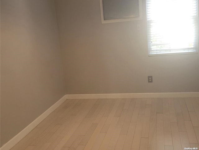 unfurnished room with light hardwood / wood-style flooring