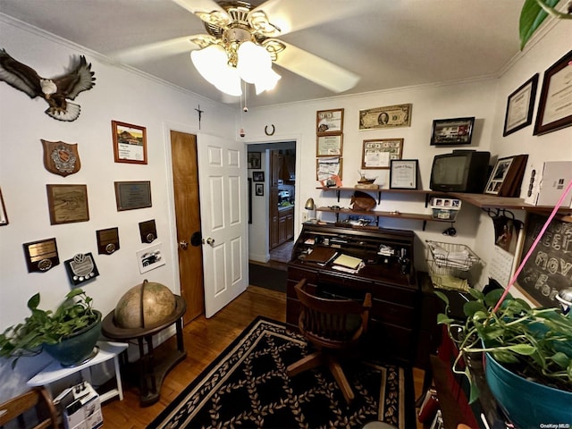 office area with dark wood-type flooring, ceiling fan, and crown molding