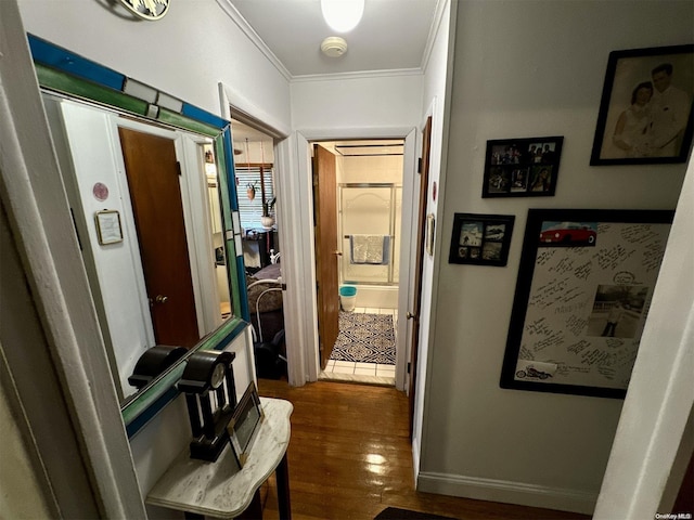 corridor with crown molding and dark wood-type flooring