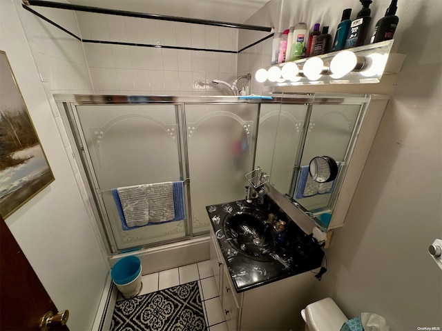 bathroom featuring tile patterned flooring and vanity