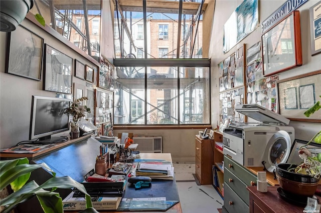 office with a wealth of natural light and concrete floors