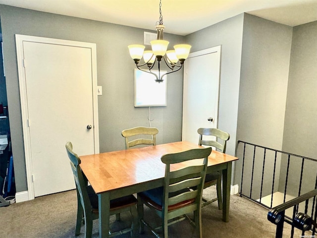 carpeted dining room with a notable chandelier