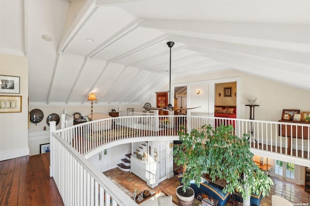 hall featuring hardwood / wood-style flooring and lofted ceiling with beams