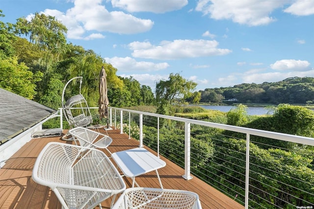 balcony featuring a water view