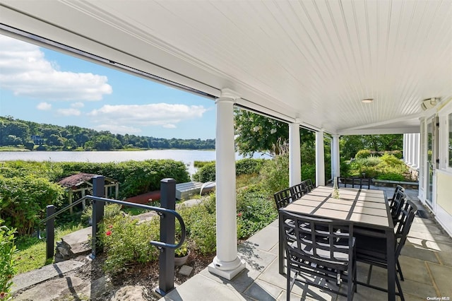 view of patio / terrace with a water view