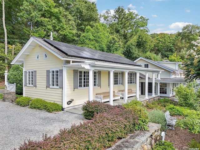 view of front of house with solar panels