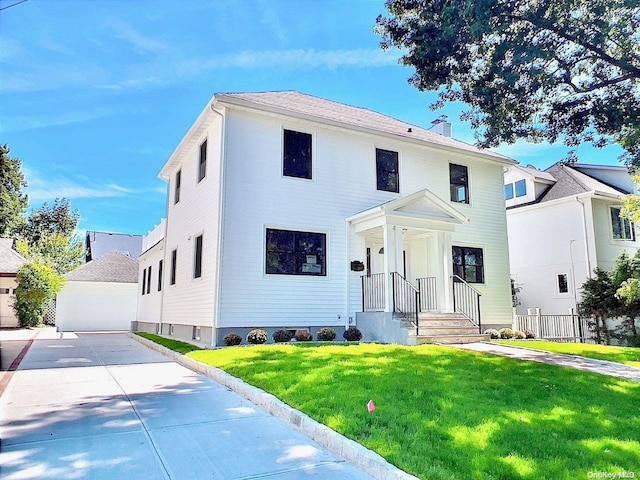 view of front of home with a front yard