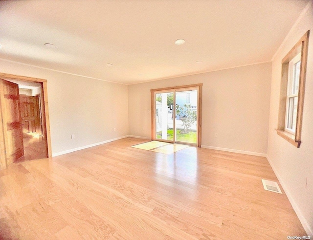 unfurnished room featuring light hardwood / wood-style flooring