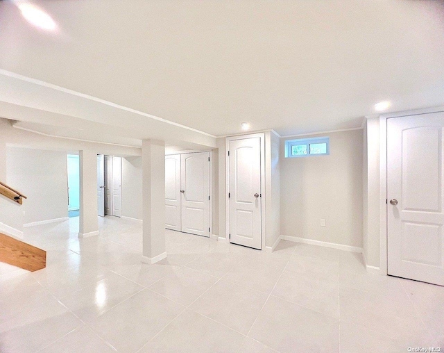 basement with light tile patterned flooring