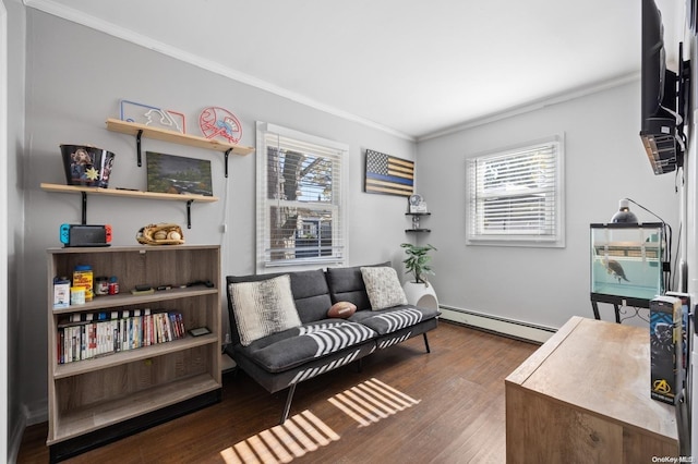 living area with dark hardwood / wood-style floors, baseboard heating, and crown molding