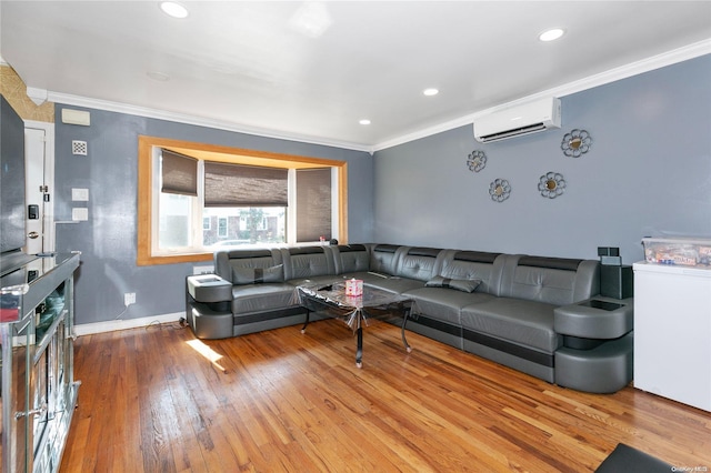 living room featuring hardwood / wood-style flooring, an AC wall unit, and ornamental molding