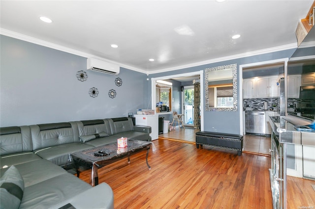 living room featuring light hardwood / wood-style floors, ornamental molding, and a wall unit AC