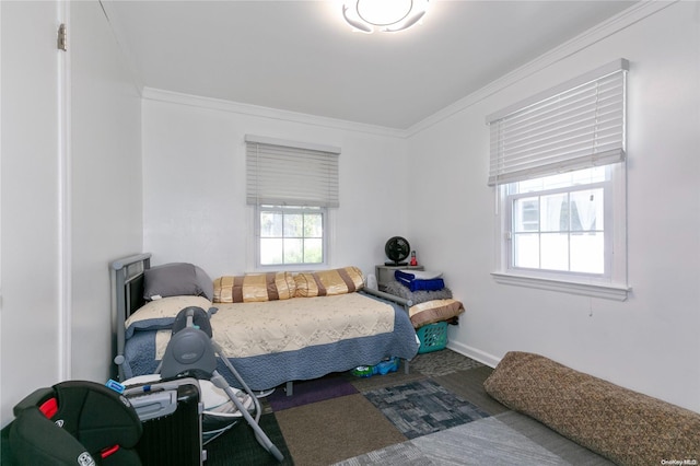 carpeted bedroom with ornamental molding