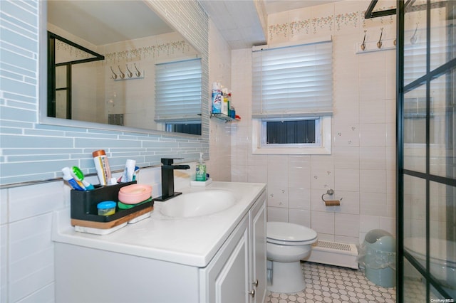 bathroom with vanity, decorative backsplash, toilet, tile walls, and walk in shower