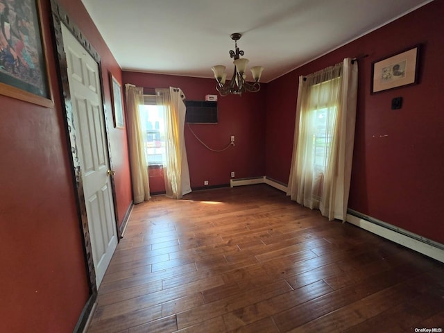 unfurnished dining area featuring a wall mounted air conditioner, dark hardwood / wood-style floors, and an inviting chandelier