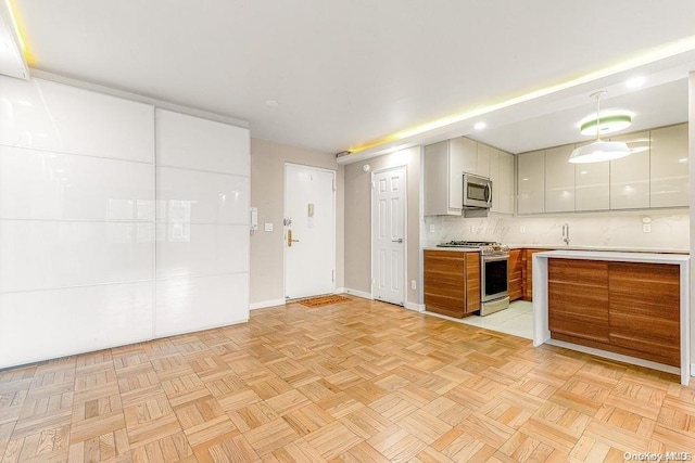 kitchen with backsplash, stainless steel appliances, white cabinetry, and light parquet flooring