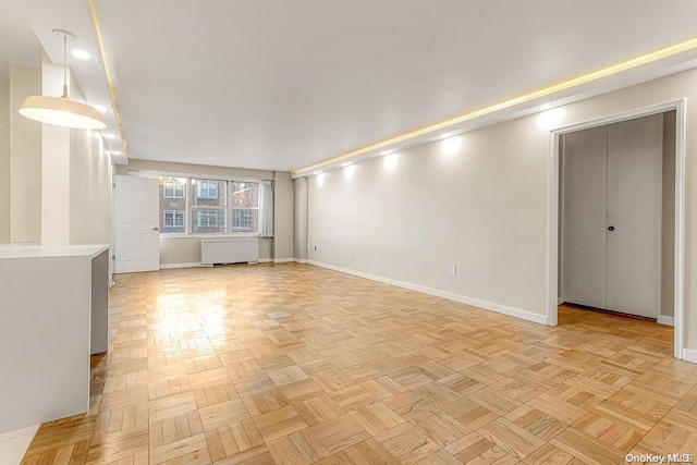 unfurnished living room with light parquet floors