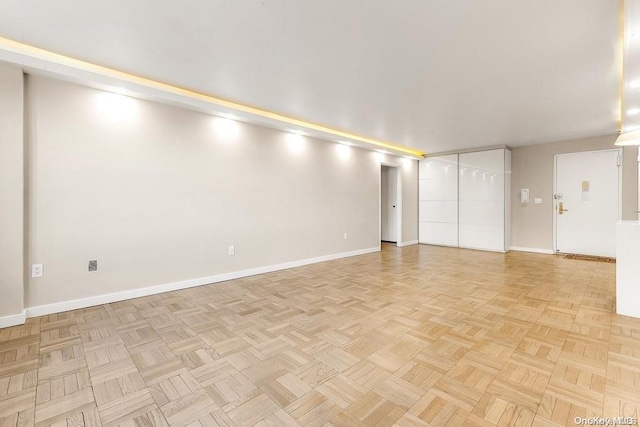 unfurnished room with light parquet floors