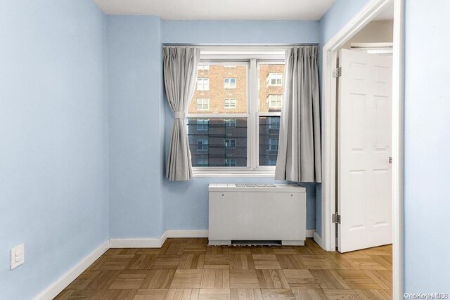 empty room with light parquet flooring