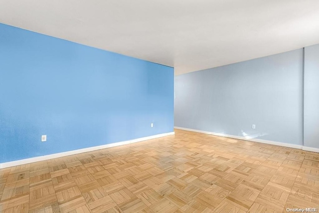 spare room featuring light parquet floors