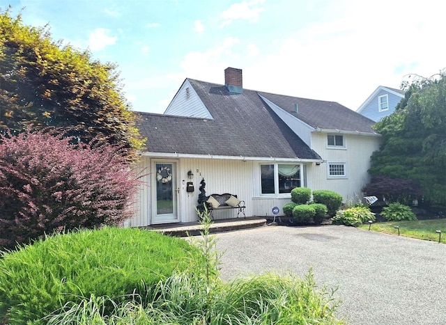 21 Piper Ln, Levittown, NY 11756 - view of front of property with a chimney