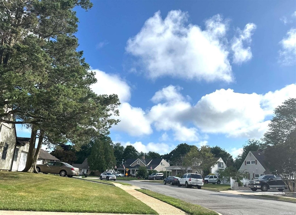 21 Piper Ln, Levittown, NY 11756 - view of asphalt street with a residential view and sidewalks