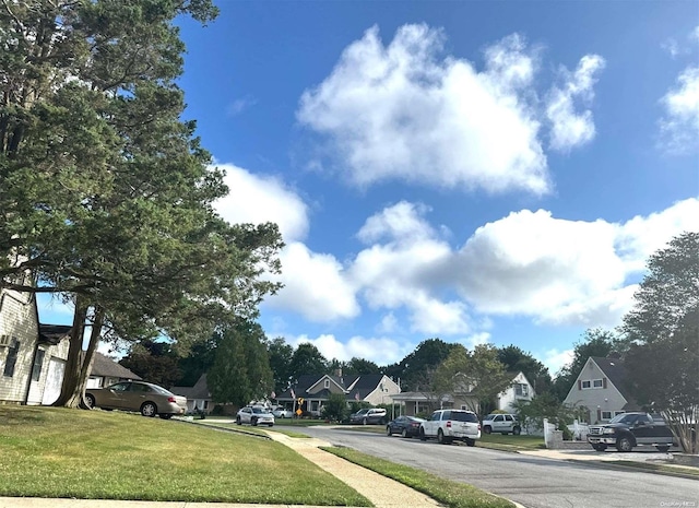 21 Piper Ln, Levittown, NY 11756 - view of asphalt street with a residential view and sidewalks