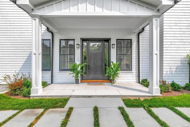 entrance to property with a porch